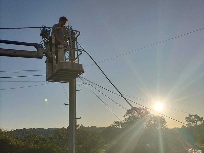 Luke Mitchell Electrical staff member fixing powerlines