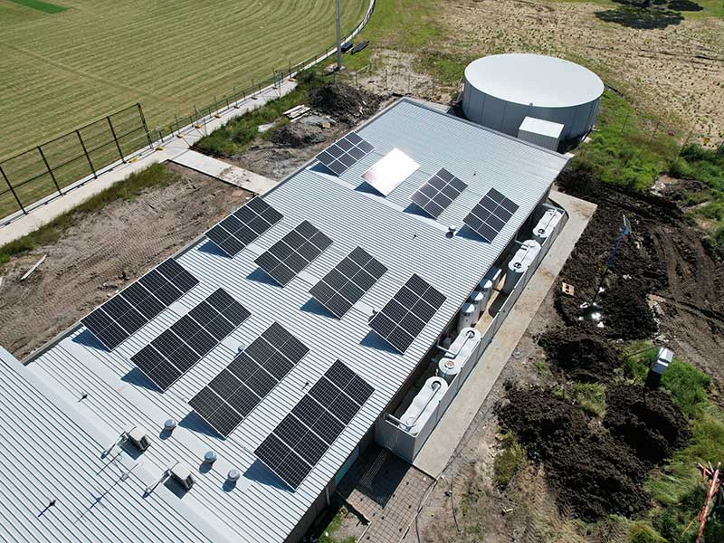 Residential property with water tank and solar panels